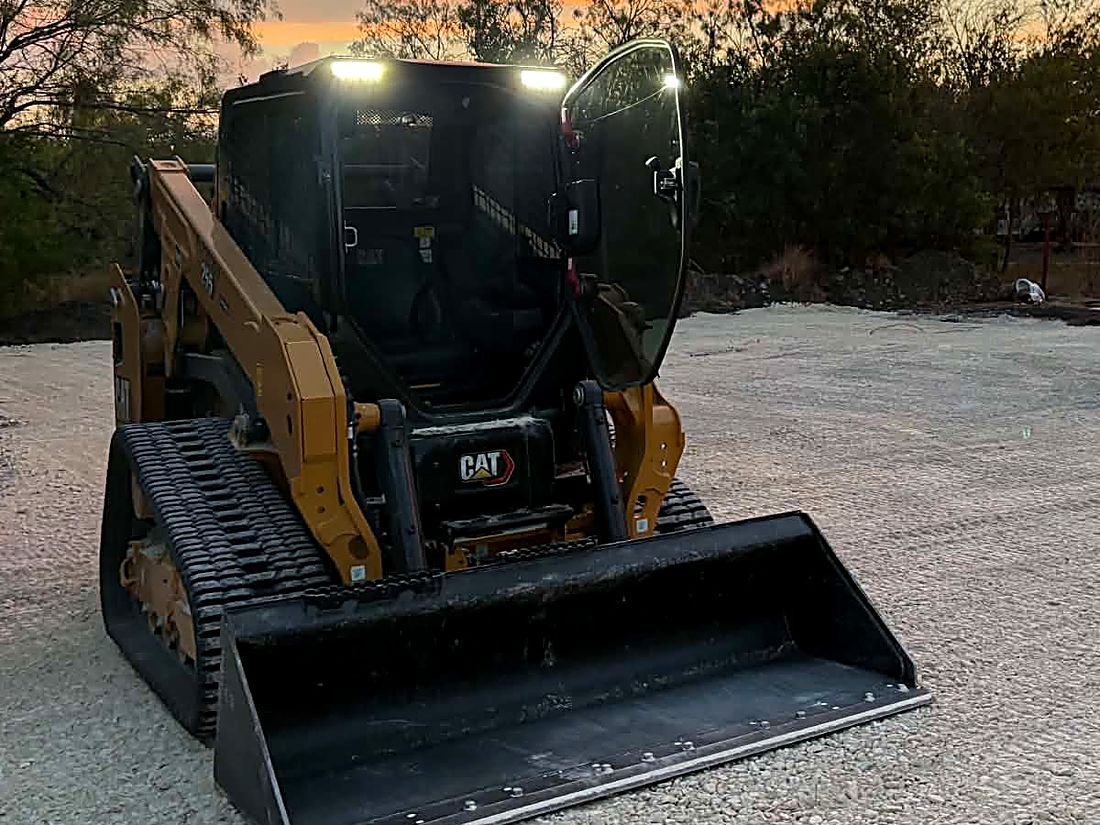 CAT compact track loader on a cleared lot